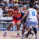 Phoenix Fuel Masters' Jason Perkins against TNT Tropang 5G defenders during a PBA Philippine Cup game.