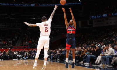 WASHINGTON, DC -  DECEMBER 12: Tre Johnson #12 of the Washington Wizards shoots a three point basket as Lonzo Ball #2 of the Cleveland Cavaliers plays defense during the game on December 12, 2025 at Capital One Arena in Washington, DC. NOTE TO USER: User expressly acknowledges and agrees that, by downloading and or using this Photograph, user is consenting to the terms and conditions of the Getty Images License Agreement. Mandatory Copyright Notice: Copyright 2025 NBAE (Photo by Stephen Gosling/NBAE via Getty Images)