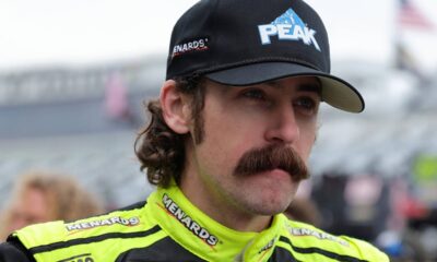An image of Team Penske NASCAR driver Ryan Blaney sporting a moustache pre-race