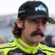An image of Team Penske NASCAR driver Ryan Blaney sporting a moustache pre-race