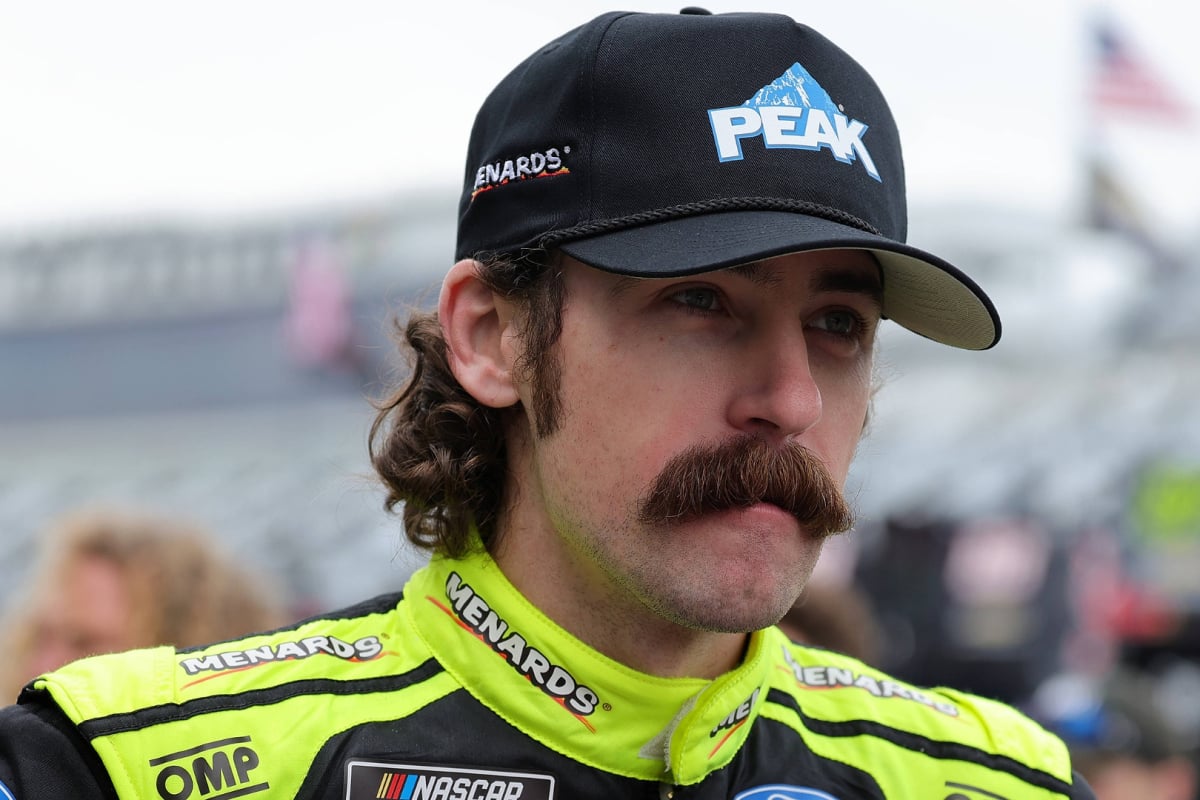 An image of Team Penske NASCAR driver Ryan Blaney sporting a moustache pre-race