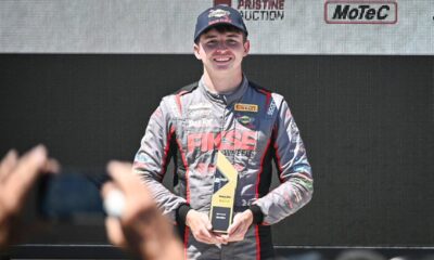 Brent Crews holds a trophy after a 2024 win at Road America