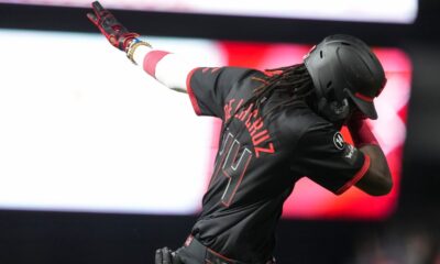 Cincinnati Reds' Elly De La Cruz gestures as he rounds the bases after hitting a solo home run during the sixth inning of a baseball game against the Chicago Cubs, Friday, Sept. 19, 2025, in Cincinnati. (AP Photo/Jeff Dean)