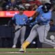 Tampa Bay Rays' Cedric Mullins (31) hits a double against the Toronto Blue Jays during the first inning of a baseball game in Toronto on Tuesday, July 21, 2026. (Jon Blacker/The Canadian Press via AP)